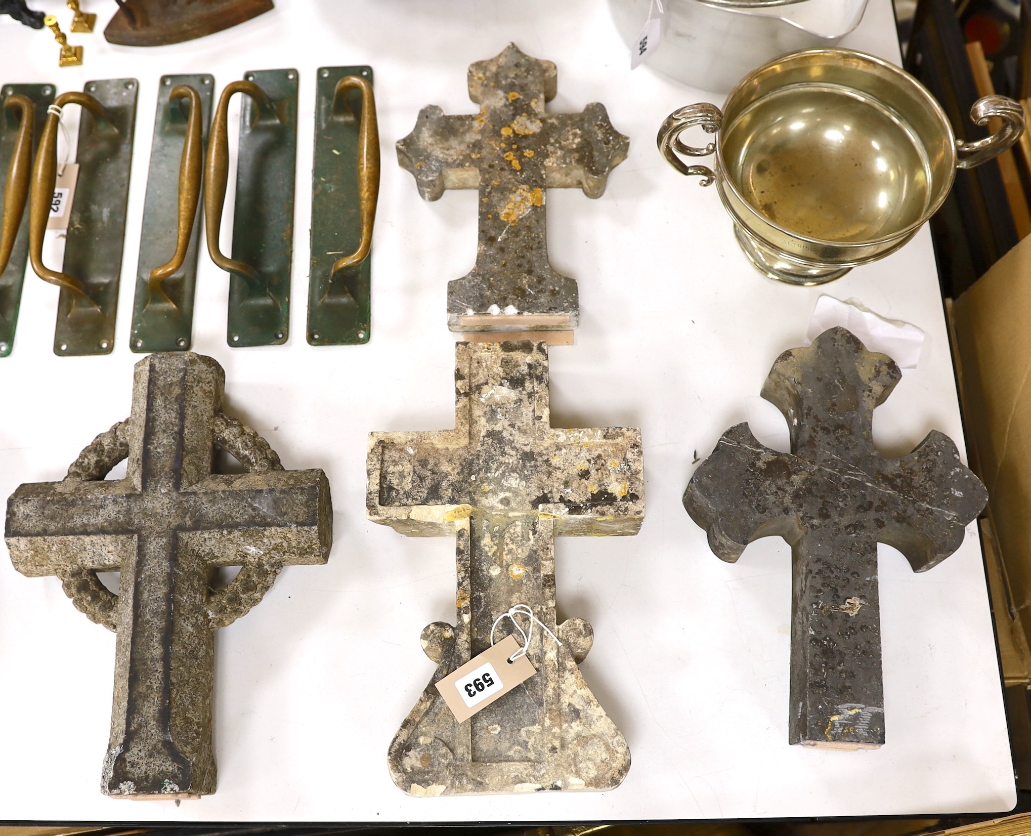 Four 19th century French stone crosses, largest 36cm tall